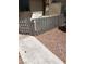 Home exterior showing a weathered fence and desert landscaping, enhancing the property's curb appeal at 4231 White Sands Ave, Las Vegas, NV 89121