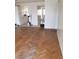 Spacious living room with detailed hardwood flooring and smooth transition to kitchen at 4231 White Sands Ave, Las Vegas, NV 89121