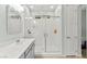 Bright bathroom features a glass-enclosed shower, a single sink vanity, and a neutral color palette at 424 Vigo Port St, Las Vegas, NV 89138
