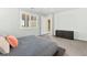 Comfortable bedroom with a plush bed, modern dresser, plantation shutters and soft, neutral walls at 424 Vigo Port St, Las Vegas, NV 89138