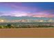 Panoramic city view showcasing the Las Vegas strip and surrounding mountains under a vibrant, colorful sunset sky at 424 Vigo Port St, Las Vegas, NV 89138