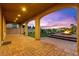 Covered patio featuring a brick floor and open archways that seamlessly blend indoor and outdoor living spaces at 424 Vigo Port St, Las Vegas, NV 89138
