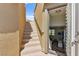 Stairway leading to a bright home entrance with an open door and view of the interior at 424 Vigo Port St, Las Vegas, NV 89138