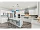 Bright, white kitchen featuring stainless steel appliances and a large center island with seating at 424 Vigo Port St, Las Vegas, NV 89138