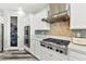 Modern kitchen featuring stainless steel appliances, custom cabinets, and a walk-in pantry at 424 Vigo Port St, Las Vegas, NV 89138