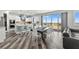 Open-concept kitchen with a large island and dining area next to sliding glass doors to the backyard at 424 Vigo Port St, Las Vegas, NV 89138