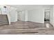 The spacious living room features modern vinyl flooring, white trim, and plenty of natural light at 424 Vigo Port St, Las Vegas, NV 89138