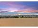 Scenic view of the city skyline with a vibrant sunset, showing rooftops in the foreground at 424 Vigo Port St, Las Vegas, NV 89138
