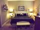 Cozy bedroom with a well appointed bed and decorative accents at 4242 Helena Hideaway Ct, Las Vegas, NV 89129