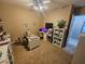 Flex space with lots of open carpeted space, neutral paint, and lots of light at 4242 Helena Hideaway Ct, Las Vegas, NV 89129
