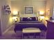 Cozy bedroom with a well appointed bed and decorative accents at 4242 Helena Hideaway Ct, Las Vegas, NV 89129