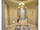 Well-lit foyer features tile flooring, recessed lighting, and decorative wall art at 4242 Helena Hideaway Ct, Las Vegas, NV 89129