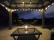 Inviting gazebo with stylish patio furniture and lighting, creating a cozy outdoor space at 4242 Helena Hideaway Ct, Las Vegas, NV 89129