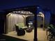 Outdoor gazebo with curtains and lights for intimate seating, offering a relaxing retreat at 4242 Helena Hideaway Ct, Las Vegas, NV 89129