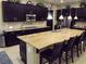 Expansive kitchen with granite countertops, stainless steel appliances, and center island at 4242 Helena Hideaway Ct, Las Vegas, NV 89129