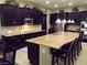Well-equipped kitchen with granite countertops, stainless steel appliances, and bar seating at 4242 Helena Hideaway Ct, Las Vegas, NV 89129