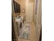 Laundry room with washer, dryer, cabinets, a window and a white door at 4242 Helena Hideaway Ct, Las Vegas, NV 89129