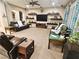 Cozy living room with large entertainment center, couches, neutral carpet, and recessed lighting at 4242 Helena Hideaway Ct, Las Vegas, NV 89129