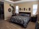Calm main bedroom with large bed, neutral carpet, recessed lights and dual windows at 4242 Helena Hideaway Ct, Las Vegas, NV 89129