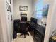 Office with an L-shaped desk, rolling chair and natural lighting at 4242 Helena Hideaway Ct, Las Vegas, NV 89129