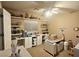 Home office with a ceiling fan, natural lighting, and custom shelving at 4242 Helena Hideaway Ct, Las Vegas, NV 89129