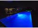 Night shot of the pool, jacuzzi and covered patio at 4242 Helena Hideaway Ct, Las Vegas, NV 89129