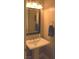 Powder room featuring a pedestal sink, bronze fixtures and decor at 4242 Helena Hideaway Ct, Las Vegas, NV 89129