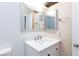 Bright bathroom features a framed mirror, a white vanity with drawers, and a faucet at 45 N Lamb Blvd, Las Vegas, NV 89110