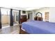 Bright bedroom with a sliding glass door, dresser, and large bed at 45 N Lamb Blvd, Las Vegas, NV 89110