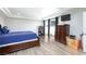 Spacious bedroom with updated floors, custom ceiling, dresser, and natural light at 45 N Lamb Blvd, Las Vegas, NV 89110