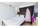 Bedroom featuring a cushioned headboard, overhead lighting, and modern flooring at 45 N Lamb Blvd, Las Vegas, NV 89110