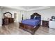 Bright bedroom featuring a large bed, two dressers, and lots of closet space at 45 N Lamb Blvd, Las Vegas, NV 89110