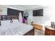 Cozy bedroom with a large bed, dresser, TV, and ample storage options at 45 N Lamb Blvd, Las Vegas, NV 89110