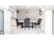 Dining area with a stylish table and chairs, decorative pillars, and tile flooring at 45 N Lamb Blvd, Las Vegas, NV 89110