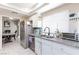 Bright kitchen featuring granite countertops, stainless steel appliances, and plenty of natural light at 45 N Lamb Blvd, Las Vegas, NV 89110