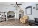 Inviting living room featuring a ceiling fan, hardwood floors, and ample natural light at 45 N Lamb Blvd, Las Vegas, NV 89110
