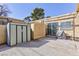 Open patio space with outdoor storage, sliding glass door access, and ample space for entertaining at 45 N Lamb Blvd, Las Vegas, NV 89110