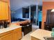 Bright kitchen featuring wood cabinets and a breakfast bar that opens to the living area at 4636 Ferrell St, North Las Vegas, NV 89031