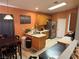 Functional kitchen with wood cabinets, stainless steel appliances, and a breakfast bar at 4636 Ferrell St, North Las Vegas, NV 89031