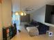 Cozy living room with tile floors, a ceiling fan, and a sliding glass door to the backyard at 4636 Ferrell St, North Las Vegas, NV 89031