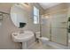 Small bathroom featuring a pedestal sink and glass enclosed shower at 467 Beardsley Cir, Henderson, NV 89052
