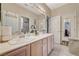 Bright bathroom with dual sinks, spacious vanity, and ample storage at 467 Beardsley Cir, Henderson, NV 89052