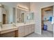 Bathroom featuring a large vanity area with a walk in closet at 467 Beardsley Cir, Henderson, NV 89052