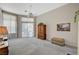 Comfortable bedroom with natural light and neutral decor at 467 Beardsley Cir, Henderson, NV 89052