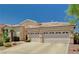 This charming home offers a spacious driveway leading to a three-car garage at 467 Beardsley Cir, Henderson, NV 89052
