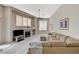 Spacious living room with a fireplace, large windows, and comfortable seating at 467 Beardsley Cir, Henderson, NV 89052
