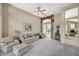 Comfortable living room featuring neutral colors and large sliding glass doors at 467 Beardsley Cir, Henderson, NV 89052