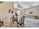 Bright living room with a stylish chandelier, neutral tones, and comfortable seating at 467 Beardsley Cir, Henderson, NV 89052