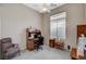 Home office featuring a ceiling fan and dark wooden desk at 467 Beardsley Cir, Henderson, NV 89052