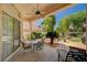 Inviting outdoor patio with comfortable seating and lush backyard views at 467 Beardsley Cir, Henderson, NV 89052